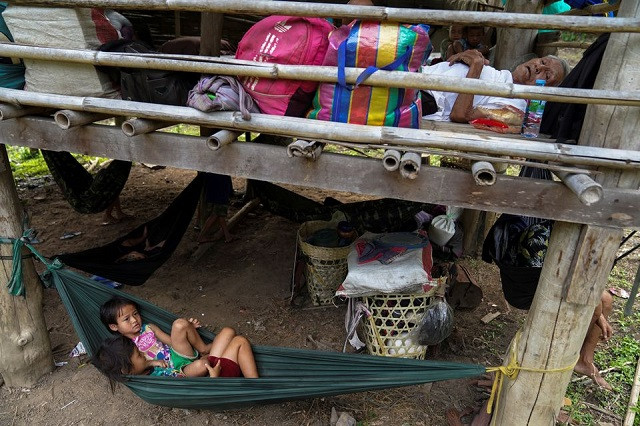 villagers who fled myanmar s ee thu hta displacement camp rest in mae hong son province thailand near the border while fleeing from gunfire between ethnic minority karen insurgents and myanmar military april 29 2021 photo reuters