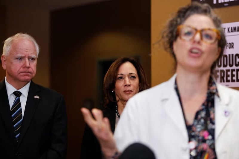US Vice President Kamala Harris and Minnesota Governor Tim Walz listen to Dr Sarah Traxler as Harris visits the St Paul Health Center, a clinic that performs abortions, in St. Paul, Minnesota, US, March 14, 2024. PHOTO: REUTERS