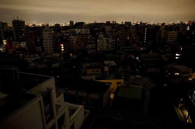 houses and buildings are seen in an electric stoppage at the area after an earthquake at toshima ward in tokyo japan march 17 2022 photo reuters