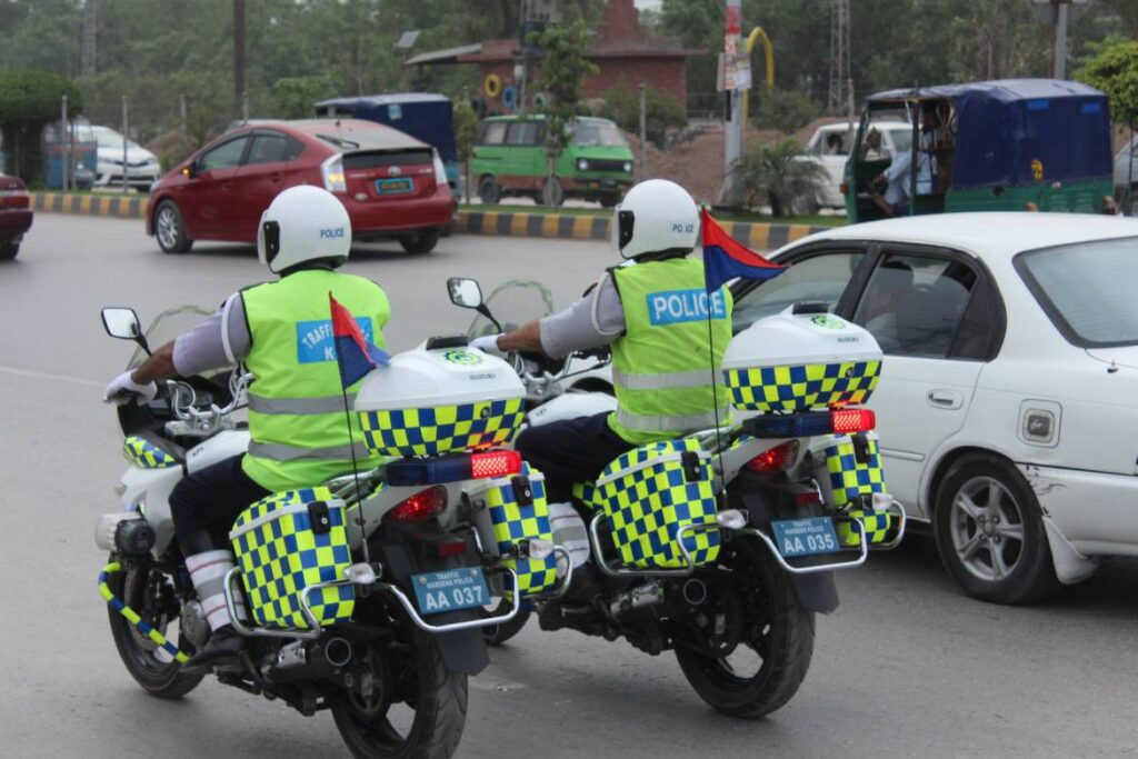 two kpk traffic police officers patrolling