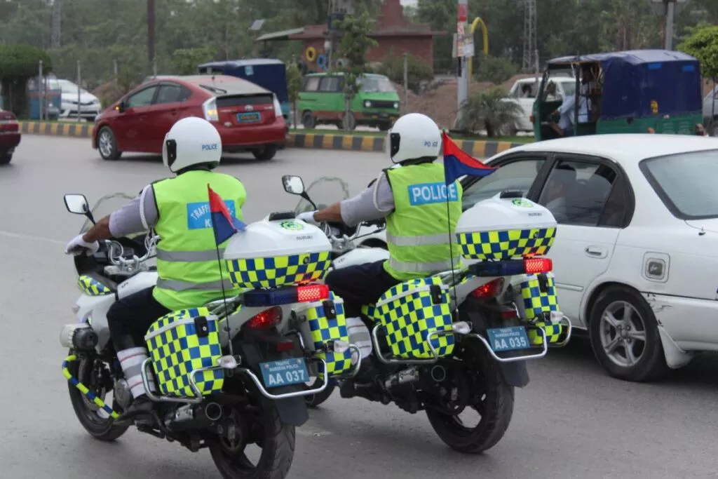 two kpk traffic police officers patrolling two kpk traffic police officers patrolling