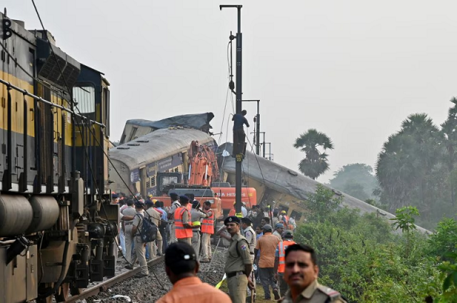 rescue workers and police stand next to coaches after a collision between two trains in andhra pradesh state india october 30 2023 photo reuters rescue workers and police stand next to coaches after a collision between two trains in andhra pradesh state india october 30 2023 photo reuters