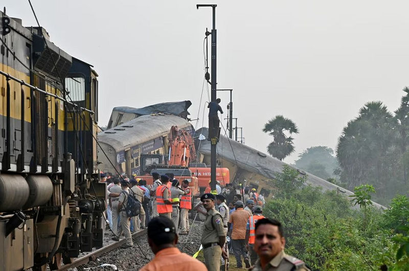 rescue workers and police stand next to coaches after a collision between two trains in andhra pradesh state india october 30 2023 photo reuters