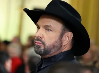 garth brooks further accused of pushing threesome with former employee and wife trisha yearwood