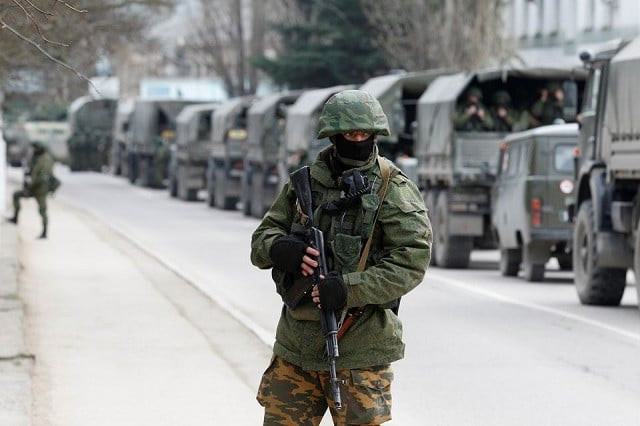 armed servicemen wait in russian army vehicles outside a ukranian border guard post in the crimean town of balaclava march 1 2014 photo reuters armed servicemen wait in russian army vehicles outside a ukranian border guard post in the crimean town of balaclava march 1 2014 photo reuters