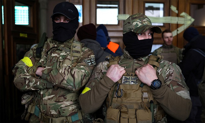 two british mercenaries at the railway station in the city of lviv ukraine on march 5 photo reuters