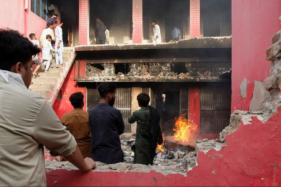 people gather at a church building vandalised by protesters in jaranwala faisalabad on august 16 2023 photo reuters