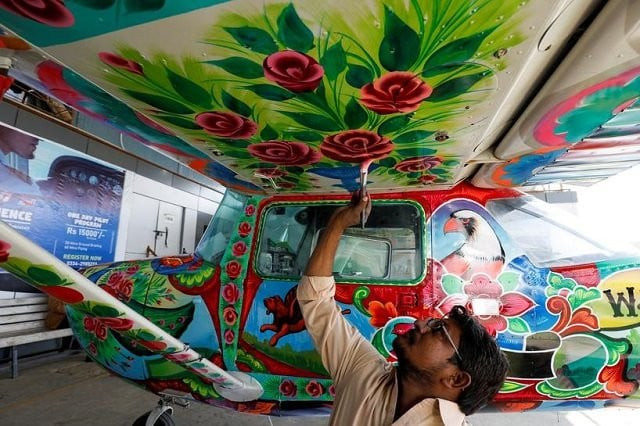 a man paints pakistani truck art on a two seater cessna aircraft at general aviation area at jinnah international airport in karachi pakistan december 30 2020 photo reuters a man paints pakistani truck art on a two seater cessna aircraft at general aviation area at jinnah international airport in karachi pakistan december 30 2020 photo reuters