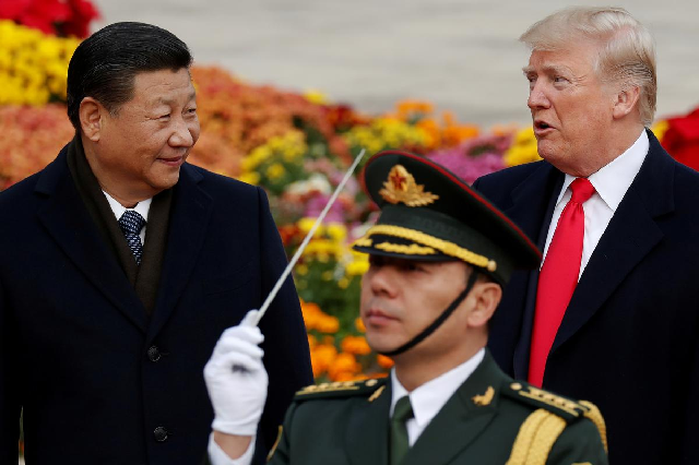 us president donald trump takes part in a welcoming ceremony with china s president xi jinping at the great hall of the people in beijing china november 9 2017 photo reuters