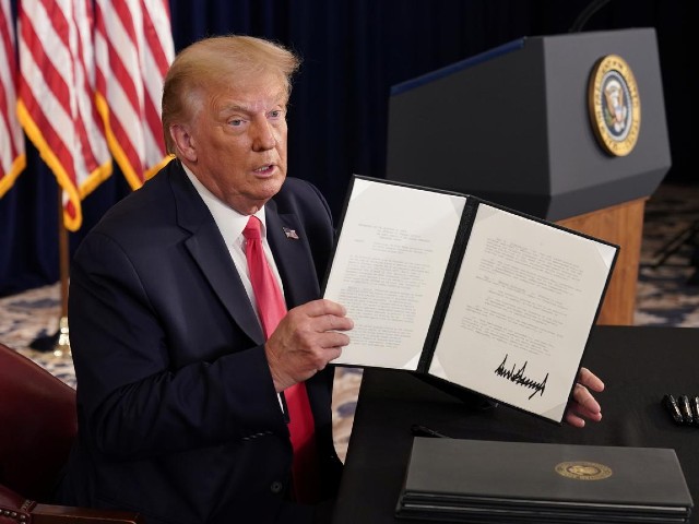 us president donald trump shows signed executive orders for economic relief during a news conference amid the spread of the coronavirus disease covid 19 at his golf resort in bedminster new jersey us august 8 2020 photo reuters file