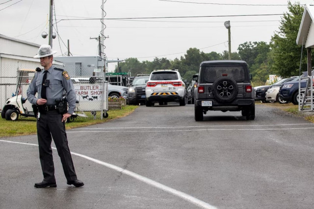 a state trooper stands guard as people are let back into the butler farm show to collect things left behind four days after the shooting by 20 year old thomas matthew crooks named by the fbi as the subject involved in the attempted assassination of former president donald trump in butler pennsylvania us july 17 2024 photo reuters a state trooper stands guard as people are let back into the butler farm show to collect things left behind four days after the shooting by 20 year old thomas matthew crooks named by the fbi as the subject involved in the attempted assassination of former president donald trump in butler pennsylvania us july 17 2024 photo reuters