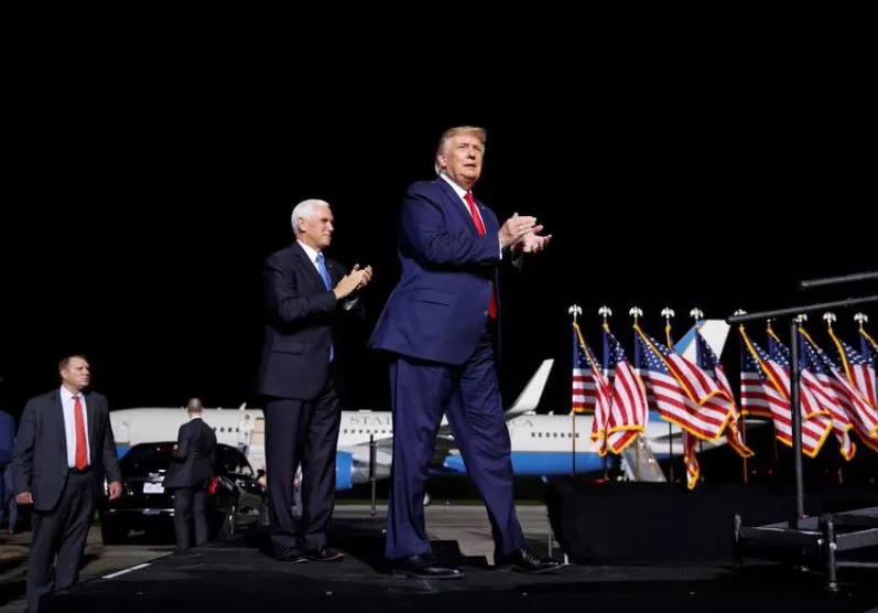 us president donald trump accompanied by vice president mike pence arrives at a campaign rally in newport news virginia us september 25 2020 reuters us president donald trump accompanied by vice president mike pence arrives at a campaign rally in newport news virginia us september 25 2020 reuters