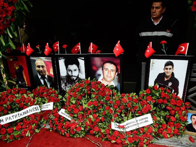 flowers left near portraits of victims in front of the reina nightclub in istanbul on december 31 2017 photo afp file