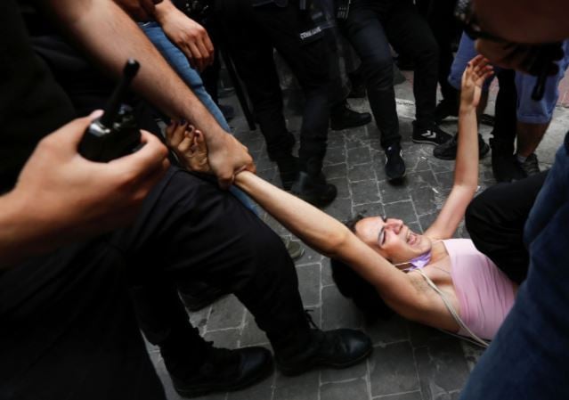 riot police detain a demonstrator as lgbt rights activists try to gather for a pride parade which was banned by local authorities in central in istanbul turkey june 26 2021 photos reuters