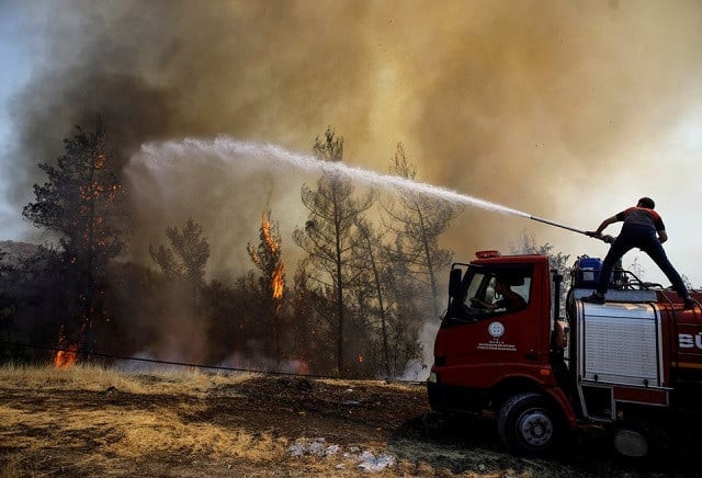 a firefighter tries to extinguish a wildfire near marmaris turkey august 1 2021 photo reuters a firefighter tries to extinguish a wildfire near marmaris turkey august 1 2021 photo reuters