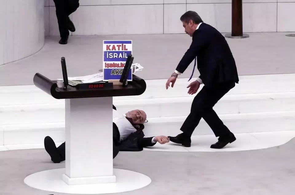 lawmaker hasan bitmez lies on the floor after collapsing at the turkish parliament in ankara turkey december 12 2023 photo reuters lawmaker hasan bitmez lies on the floor after collapsing at the turkish parliament in ankara turkey december 12 2023 photo reuters