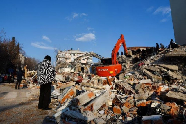 a person looks at rubble and debris following an earthquake in kahramanmaras turkiye february 8 2023 photo reuters a person looks at rubble and debris following an earthquake in kahramanmaras turkiye february 8 2023 photo reuters