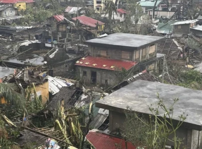 man yi weakens as it crosses philippines island