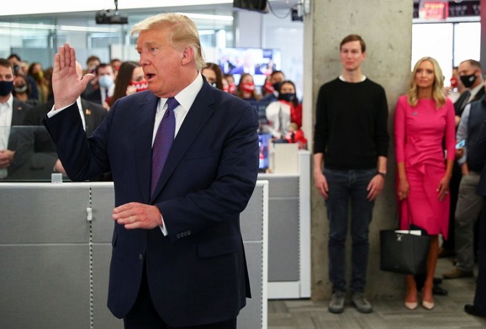 us president donald trump speaks to staff members while his son in law and senior advisor jared kushner and his white house press secretary kayleigh mcenany listen as he visits his presidential campaign headquarters on election day in nearby arlington virginia us november 3 2020 photo reuters