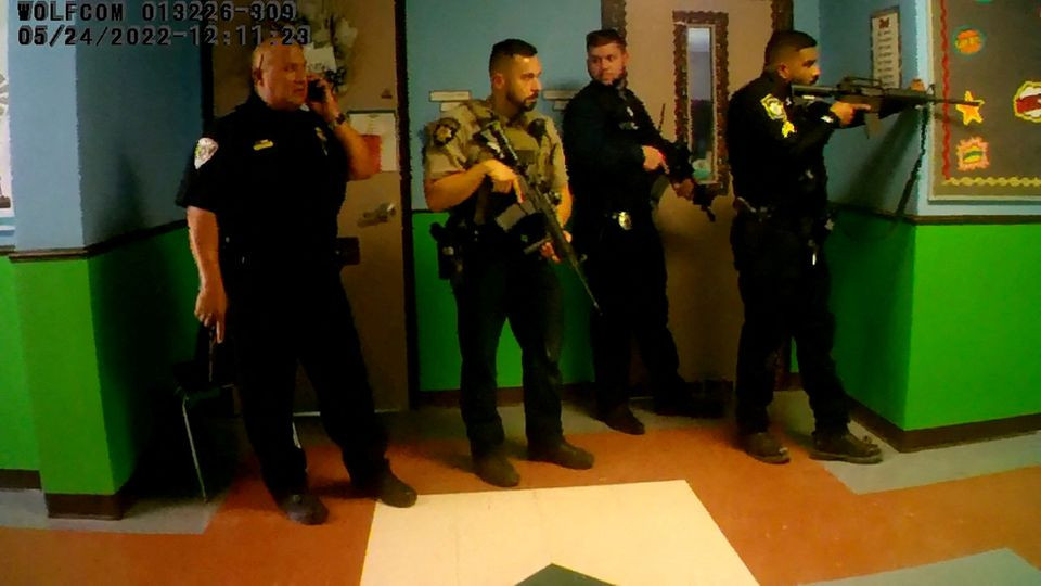 police deploy in a hallway after salvador ramos entered robb elementary school to kill 19 children and two teachers in uvalde texas u s may 24 2022 in a still image from police body camera video reuters