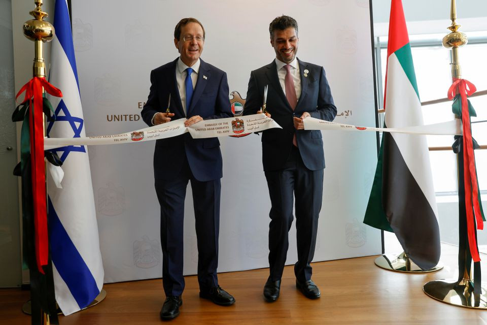 uae ambassador to israel mohamed al khaja and israeli president isaac herzog cut a ribbon during the opening ceremony of the emirati embassy in tel aviv israel july 14 2021 reuters amir cohen