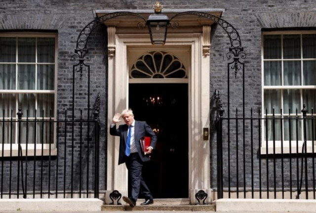 former british prime minister boris johnson walks at downing street in london britain july 6 2022 reuters former british prime minister boris johnson walks at downing street in london britain july 6 2022 reuters