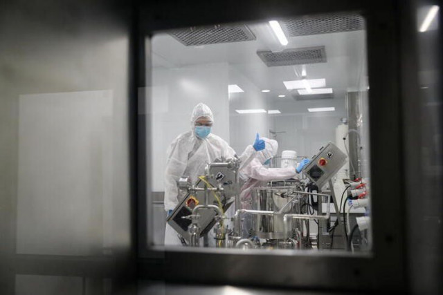 production scientists work in a laboratory at biotech start up afrigen biologics as it gears up for the production of africa s first covid 19 vaccine using the mrna platform in cape town south africa june 23 2021 photo reuters file production scientists work in a laboratory at biotech start up afrigen biologics as it gears up for the production of africa s first covid 19 vaccine using the mrna platform in cape town south africa june 23 2021 photo reuters file