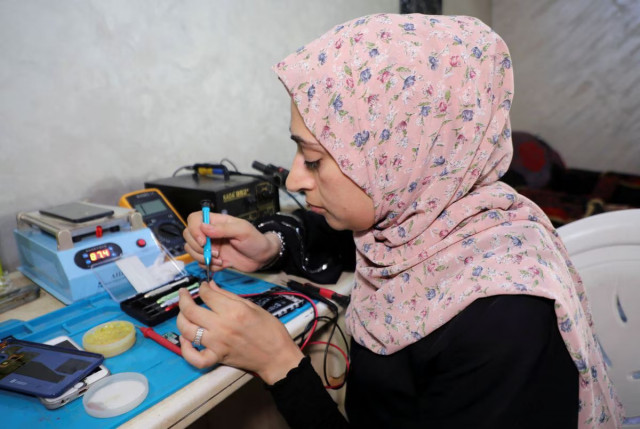 in conservative gaza a woman finds rare job niche by repairing phones in conservative gaza a woman finds rare job niche by repairing phones