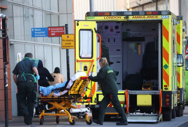 paramedics transfer a patient outside the royal london hospital amid the coronavirus disease covid 19 outbreak in london britain january 23 2021 photo reuters paramedics transfer a patient outside the royal london hospital amid the coronavirus disease covid 19 outbreak in london britain january 23 2021 photo reuters