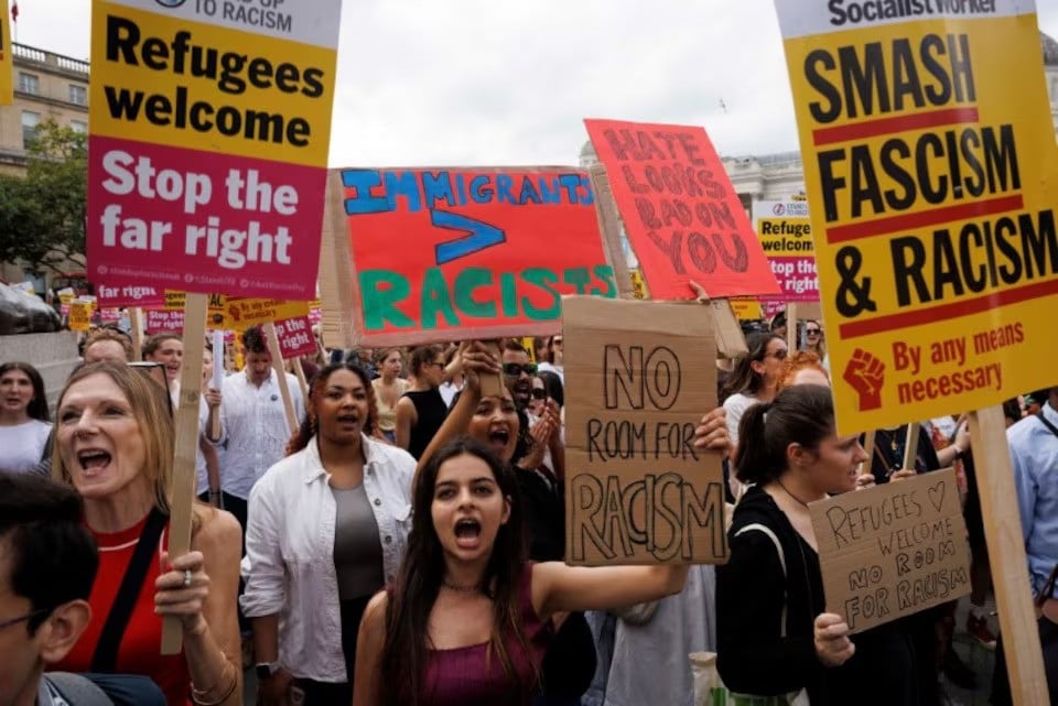 people hold signs at a protest against racism in westminster in london britain on august 10 2024 photo reuters