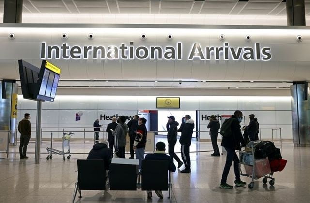 people wait and check the screens as tighter rules for international travellers start at heathrow airport amid the spread of the coronavirus disease covid 19 pandemic london britain january 18 2021 photo reuters