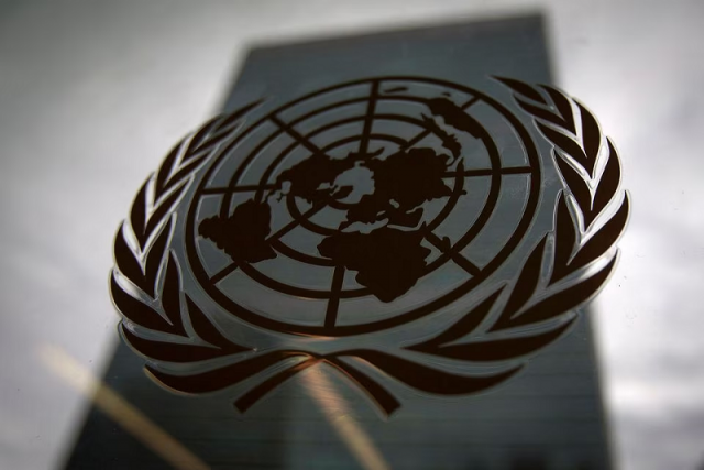 the united nations headquarters building is pictured though a window with the un logo in the foreground in the manhattan borough of new york august 15 2014 photo reuters the united nations headquarters building is pictured though a window with the un logo in the foreground in the manhattan borough of new york august 15 2014 photo reuters
