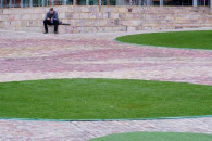 a lone man sits at a deserted federation square on the first day of a lockdown as the state of victoria looks to curb the spread of covid 19 in melbourne australia july 16 2021 photo reuters