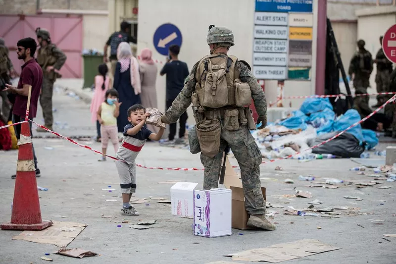 a us marine provides a meal ready to eat to a child during an evacuation at hamid karzai international airport kabul afghanistan august 21 2021 photo reuters a us marine provides a meal ready to eat to a child during an evacuation at hamid karzai international airport kabul afghanistan august 21 2021 photo reuters