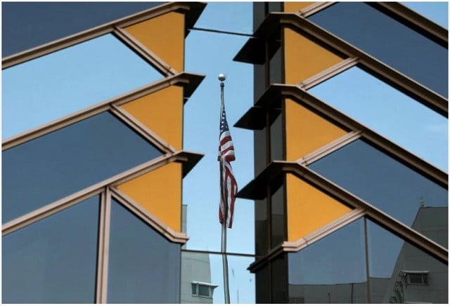 the us flag is reflected on the windows of the us embassy in kabul afghanistan july 30 2021 photo reuters