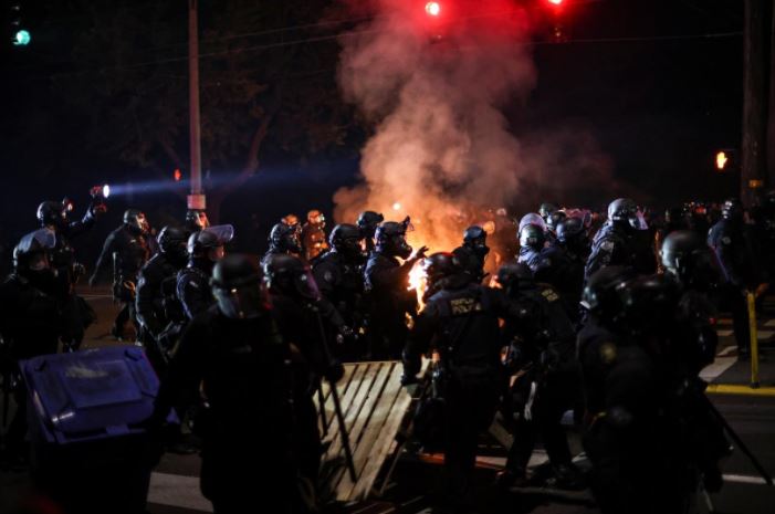 Police Use Tear Gas, Portland Protesters Throw Fire Bombs