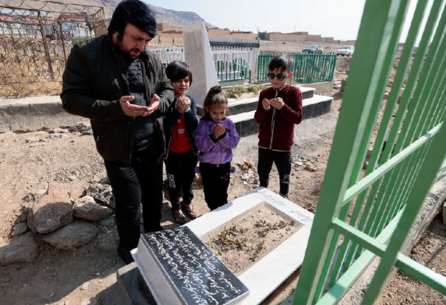 ajamal ahmadi stands with his nephews as they pray by the grave of arwin 7 a relative who was a victim of a us drone strike that killed 10 civilians including seven children in kabul afghanistan november 7 2021 photo reuters ajamal ahmadi stands with his nephews as they pray by the grave of arwin 7 a relative who was a victim of a us drone strike that killed 10 civilians including seven children in kabul afghanistan november 7 2021 photo reuters