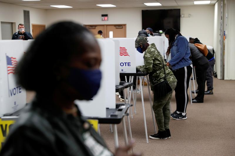 people vote at a polling station during the 2020 us presidential election in flint michigan us november 3 2020 photo reuters file