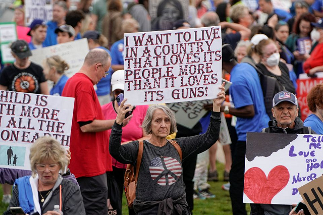 demonstrators hold placards as they take part in the march for our lives one of a series of nationwide protests against gun violence in washington dc us june 11 2022 photo reuters