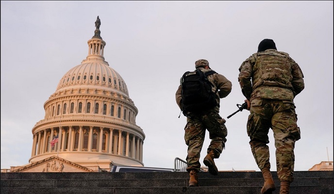 national guard members walk at the capitol in washington us january 15 2021 photo reuters