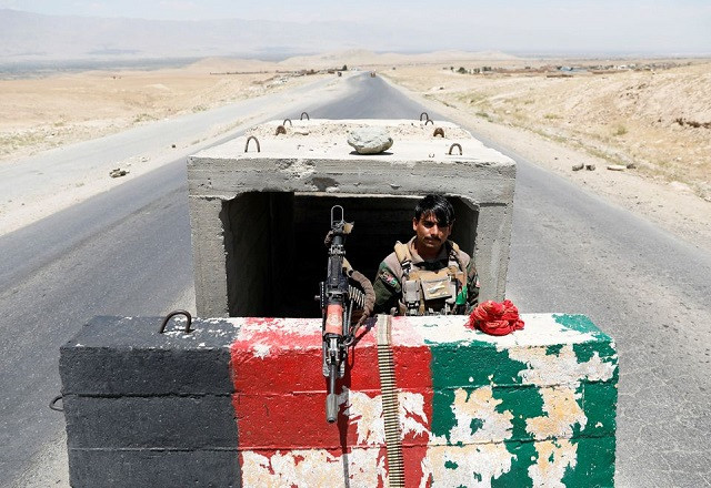 An Afghan National Army soldier stands guard at a checkpoint near Bagram US air base, on the day the last of American troops vacated it, Parwan province, Afghanistan July 2, 2021. PHOTO: REUTERS