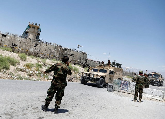 Afghan soldiers stand guard at a checkpoint outside the US Bagram air base, on the day the last of American troops vacated it, Parwan province, Afghanistan July 2, 2021. PHOTO: REUTERS