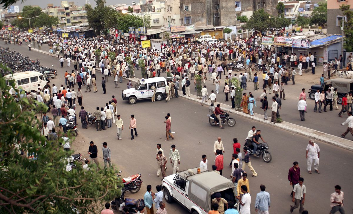 people crowd on a road after a series of bombings in the western indian city of ahmedabad july 26 2008 photo reuters