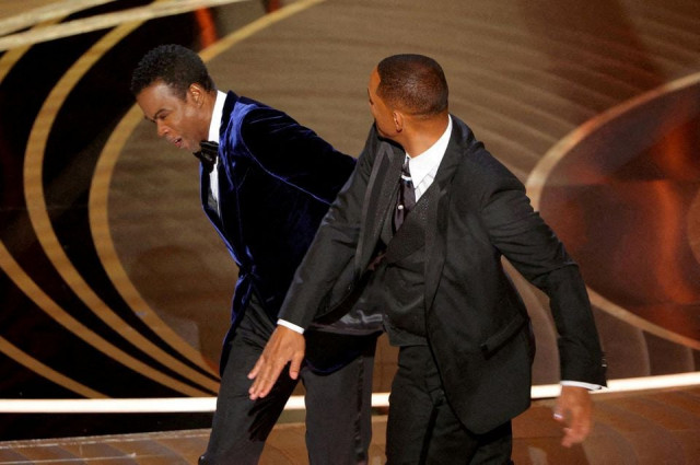 will smith r hits chris rock as rock spoke on stage during the 94th academy awards in hollywood los angeles california u s march 27 2022 reuters brian snyder will smith r hits chris rock as rock spoke on stage during the 94th academy awards in hollywood los angeles california u s march 27 2022 reuters brian snyder