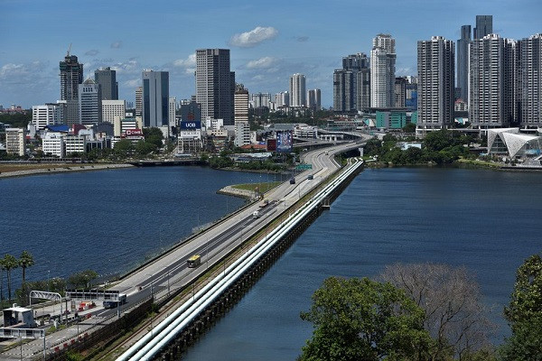 a vaccinated travel lane vtl bus plies the causeway between singapore and malaysia as it reopens after nearly two years amidst the coronavirus disease covid 19 pandemic singapore november 29 2021 photo reuters