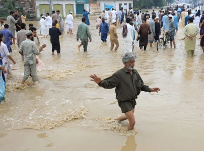 swollen kabul river threatens more flooding
