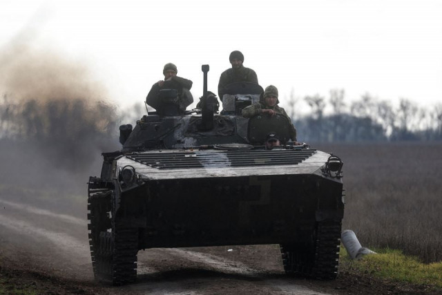 ukrainian servicemen ride an armoured fighting vehicle amid russia s attack on ukraine in a frontline in mykolaiv region ukraine november 4 2022 photo reuters
