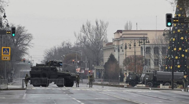 kazakh service members stand guard at a checkpoint following the protests triggered by fuel price increase in almaty kazakhstan january 7 2022 photo reuters kazakh service members stand guard at a checkpoint following the protests triggered by fuel price increase in almaty kazakhstan january 7 2022 photo reuters