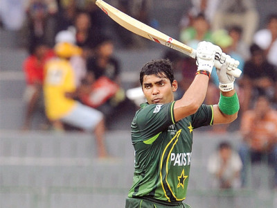 umar dons gloves as kamran looks on