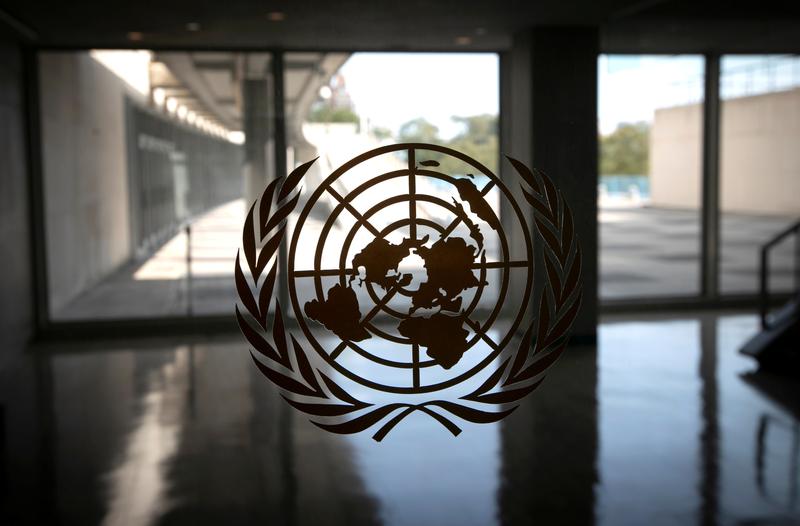 the united nations logo is seen on a window in an empty hallway at un headquarters in new york us photo reuters file